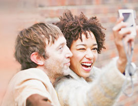 geeky couple taking a selfie